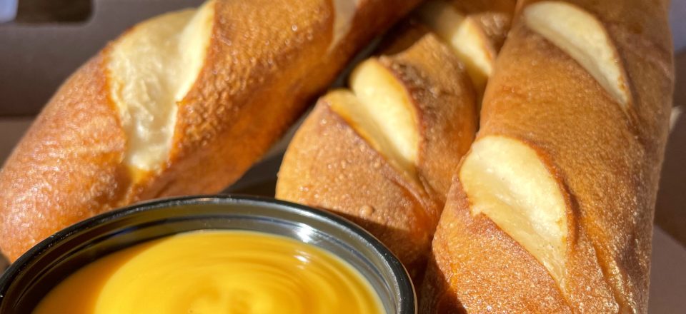 Jumbo Pretzel Sticks with a side of cheese sauce