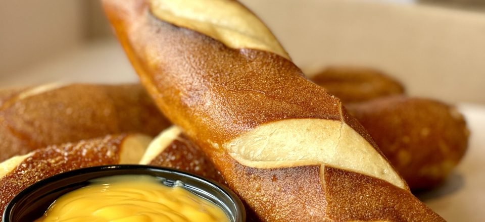 jumbo pretzel sticks with cheese dip